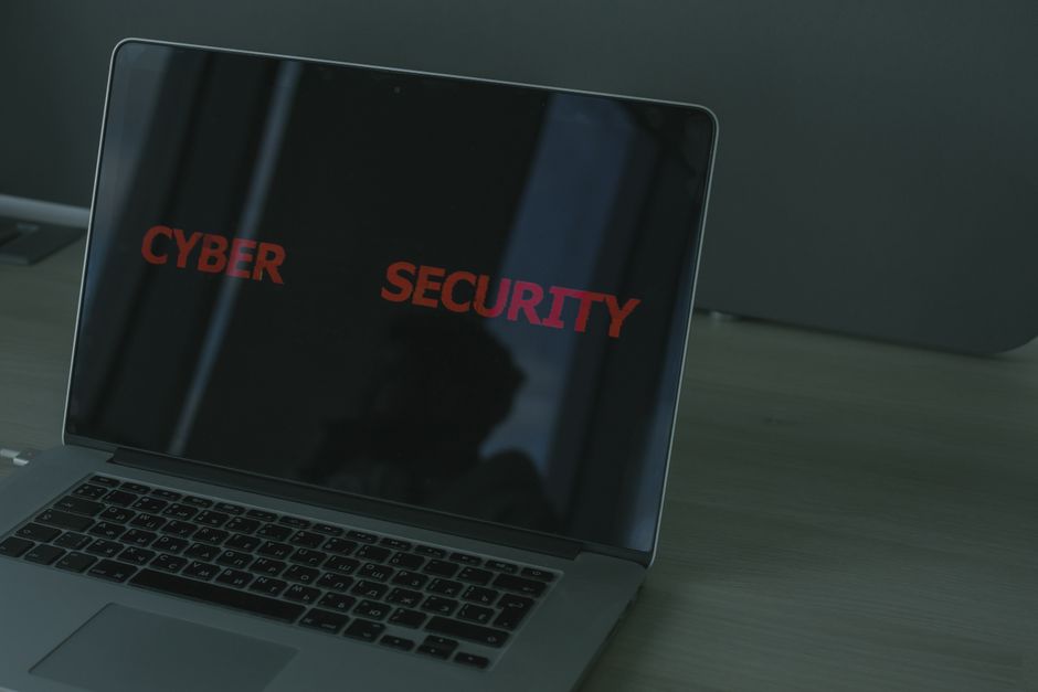 A laptop displaying the words cyber security