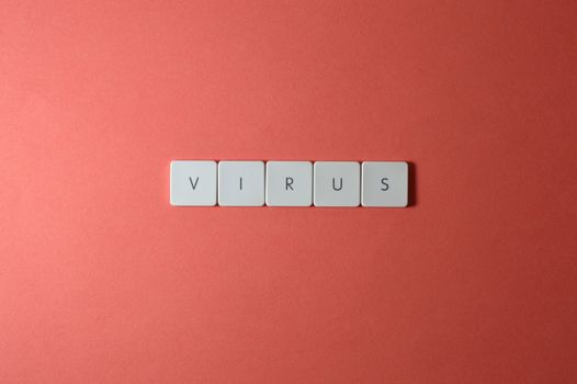 Keyboard keys spelling the word virus on a red background